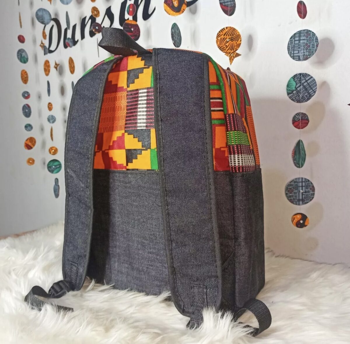 African fabric backpack with bold Ankara prints, Stylish Ankara drawstring bags for everyday use, leather drawstring bags, Ankara drawstring, Ankara bags, African-inspired drawstring bags, Ankara tote bags, Ankara print handbags, Handmade fabric totebags, how to make Ankara bags, African-inspired Adire fabric drawstring bags, 2024 ankara backpacks, Fashionable Ankara fabric tote bag, unisex drawstring bag, African tote bags, 2024 Ankara bags, 2024 Ankara fashion accessories, afrocentric accessories, fashion accessories, Africa fashion accessories, Nigerian fashion industry, Ankara bags for women, Ankara bags on Amazon, African products on Amazon, DunsinCrafts, DunsinCraft Collection, Ankara shoulder bag, Ankara drawstring bags for men, Ankara tote bags for women, Ankara tote bag design 2024, luxury tote bags, drawstring bags in Nigeria, Tote bags in Nigeria