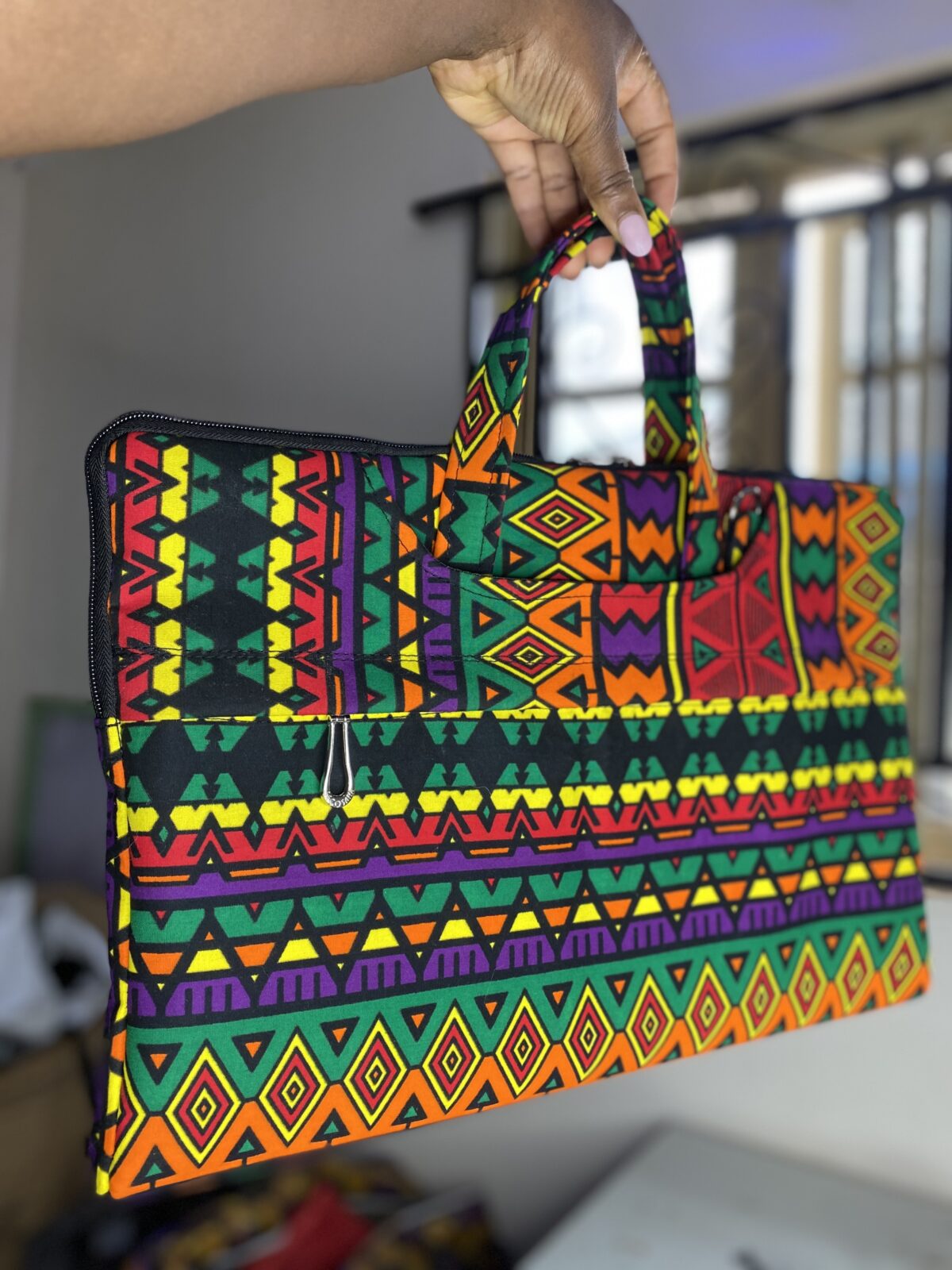 African fabric laptop bag with bold Ankara prints, Stylish Adire fabric laptop bag for everyday office use, Ankara laptop bags, Ankara bags, African-inspired handbags, Ankara messenger bags, Ankara print laptop bags, Handmade fabric laptop bags, how to make Ankara bags, African-inspired Adire fabric laptop bags, 2024 ankara laptop bags, Ankara souvenir laptop bags, African laptop bags, 2024 Ankara laptop bags, 2024 Ankara fashion accessories, afrocentric accessories, fashion accessories, Africa fashion accessories, Nigerian fashion industry, Ankara laptop bags for women, Ankara bags on Amazon, African products on Amazon, DunsinCrafts, DunsinCraft Collection, Ankara laptop bags for men, customizable Ankara laptop bag