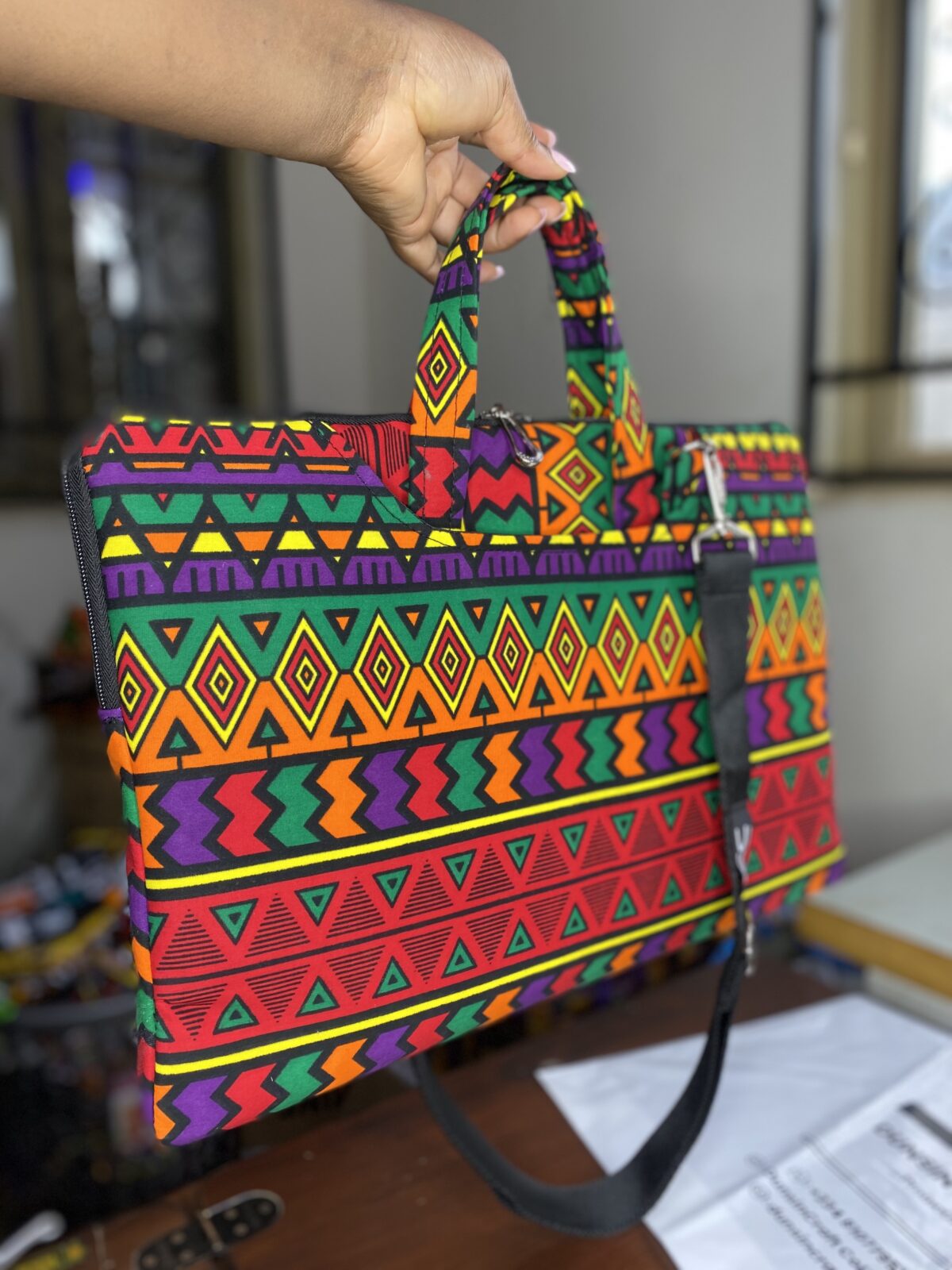 African fabric laptop bag with bold Ankara prints, Stylish Adire fabric laptop bag for everyday office use, Ankara laptop bags, Ankara bags, African-inspired handbags, Ankara messenger bags, Ankara print laptop bags, Handmade fabric laptop bags, how to make Ankara bags, African-inspired Adire fabric laptop bags, 2024 ankara laptop bags, Ankara souvenir laptop bags, African laptop bags, 2024 Ankara laptop bags, 2024 Ankara fashion accessories, afrocentric accessories, fashion accessories, Africa fashion accessories, Nigerian fashion industry, Ankara laptop bags for women, Ankara bags on Amazon, African products on Amazon, DunsinCrafts, DunsinCraft Collection, Ankara laptop bags for men, customizable Ankara laptop bag